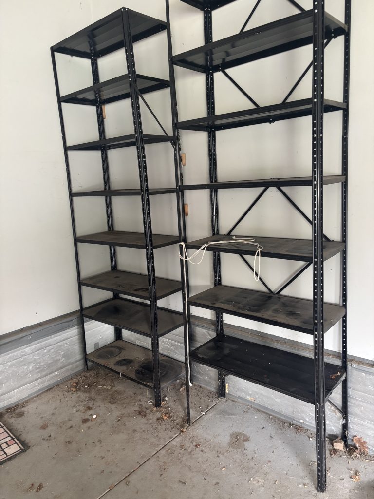After photo of a clean, empty storage shelf following detailed clutter removal service in Omaha, Nebraska.